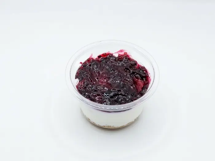 Blueberry cheesecake cup with berry compote