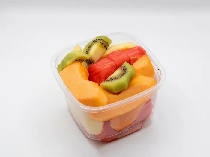 Fresh fruit salad cup with watermelon, cantaloupe and kiwi