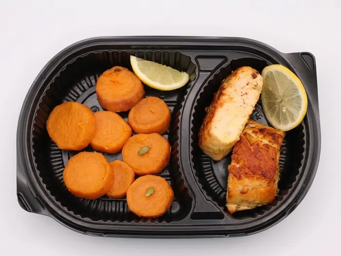 Grilled salmon fillet with roasted sweet potato and lemon