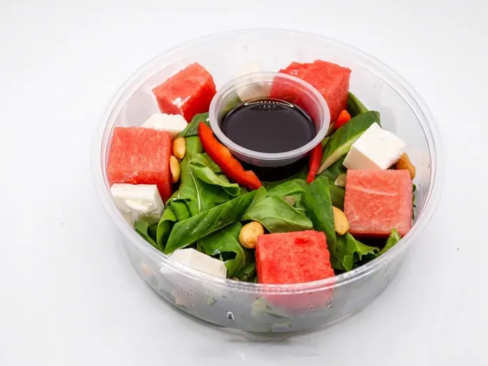 Watermelon and feta cheese salad with arugula and cashews